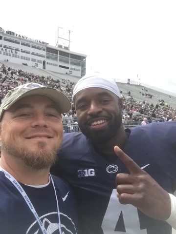 Coach Kevin Simonds with Nick Scott at a Penn State football game. 